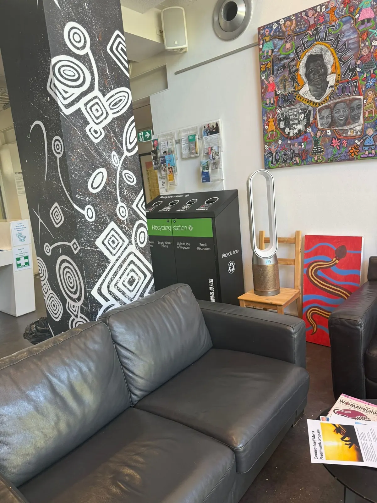 Recycling station placed inside a lounge area near public seating